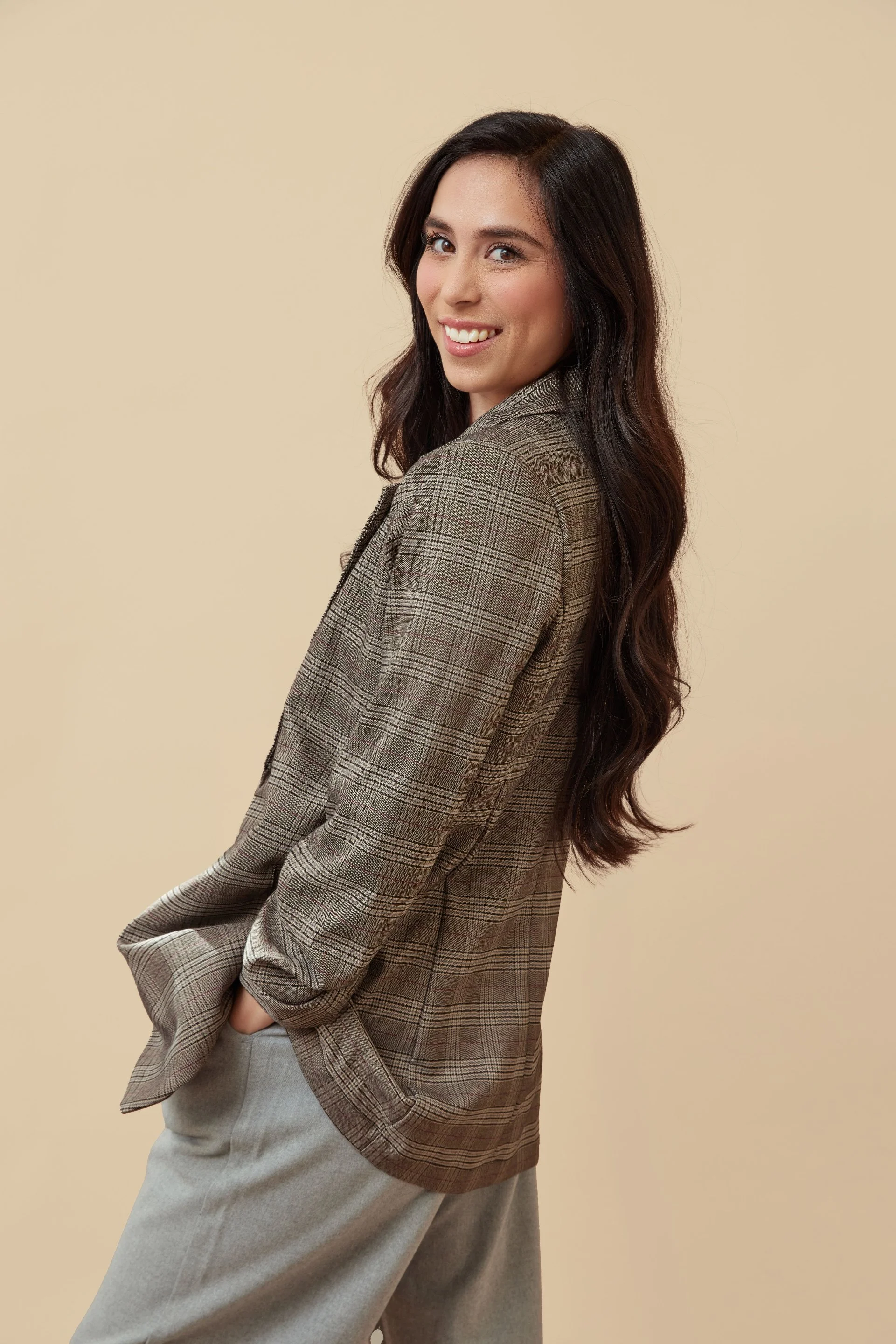 Portrait of Andria, founder of The Salt & Serenity, photographed in a neutral studio setting.