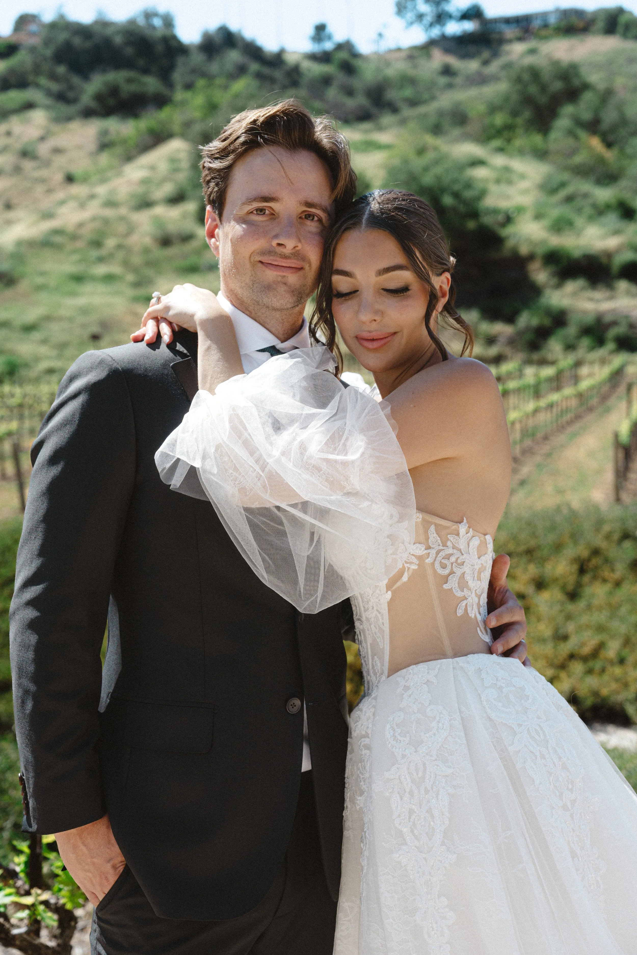 Romantic bride and groom portrait at Monserate Winery in Fallbrook California with vineyard views and soft natural light