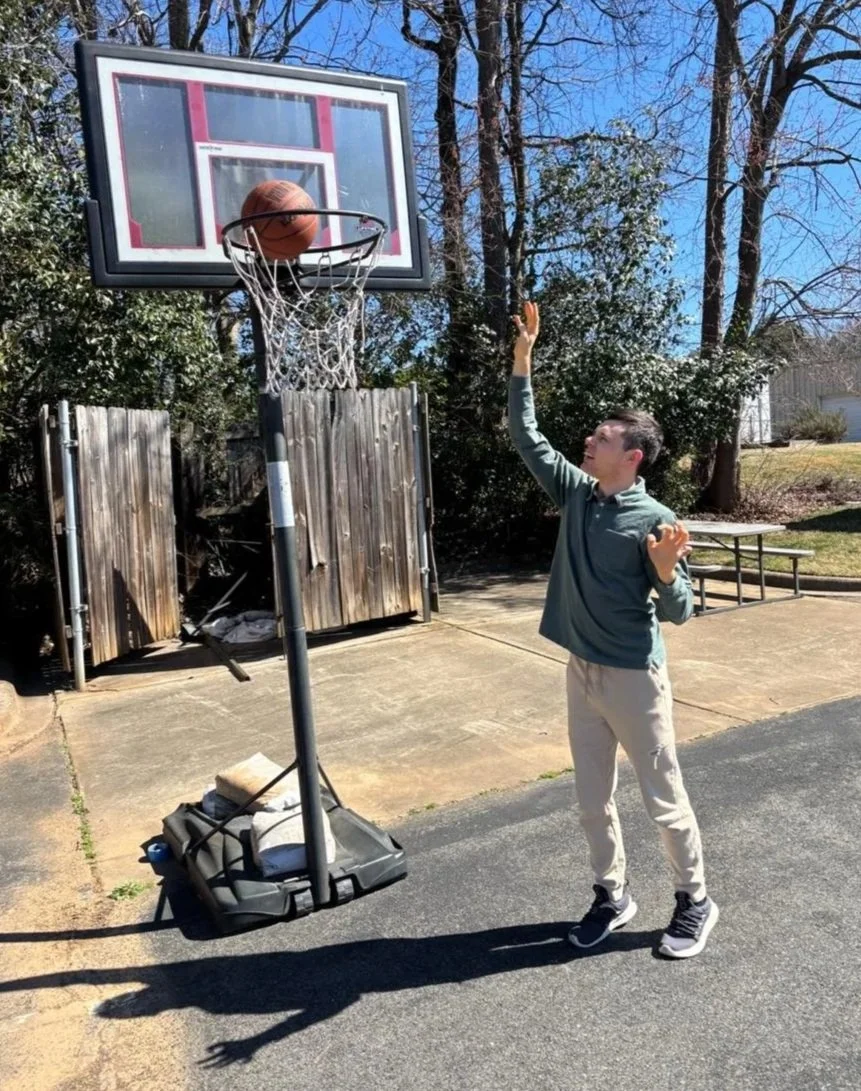 Peter scoring a basket in the sun