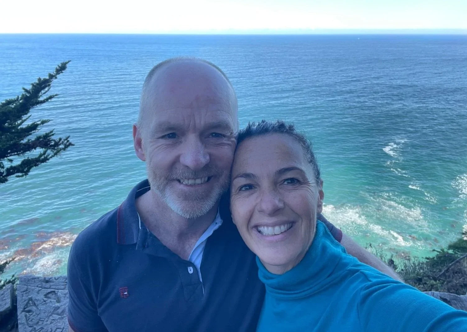 Mich with Brent with a view of the sea behind them