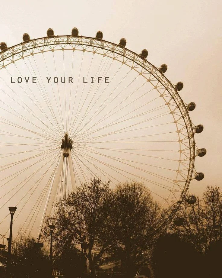 A Ferris wheel with the words LOVE YOUR LIFE written across the top of the page.