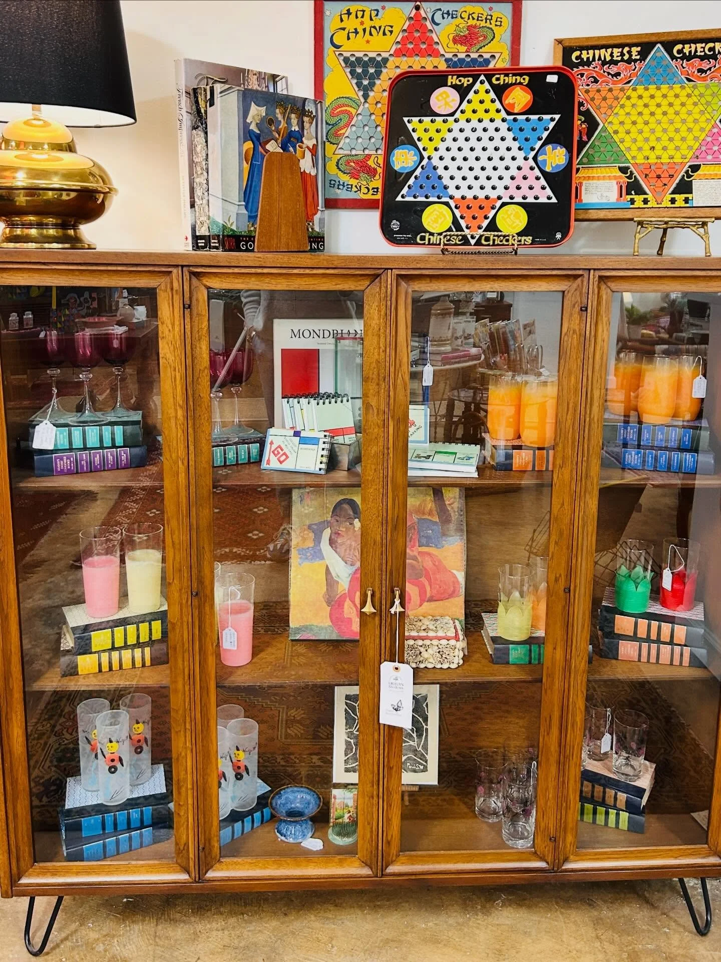 Someone could have easily discarded this Broyhill China Cabinet but they chose to refinish and rework it. This is actually the hutch portion that had legs added for a whole new look and function. Courtesy of @magpiereclamations and styled by the phen