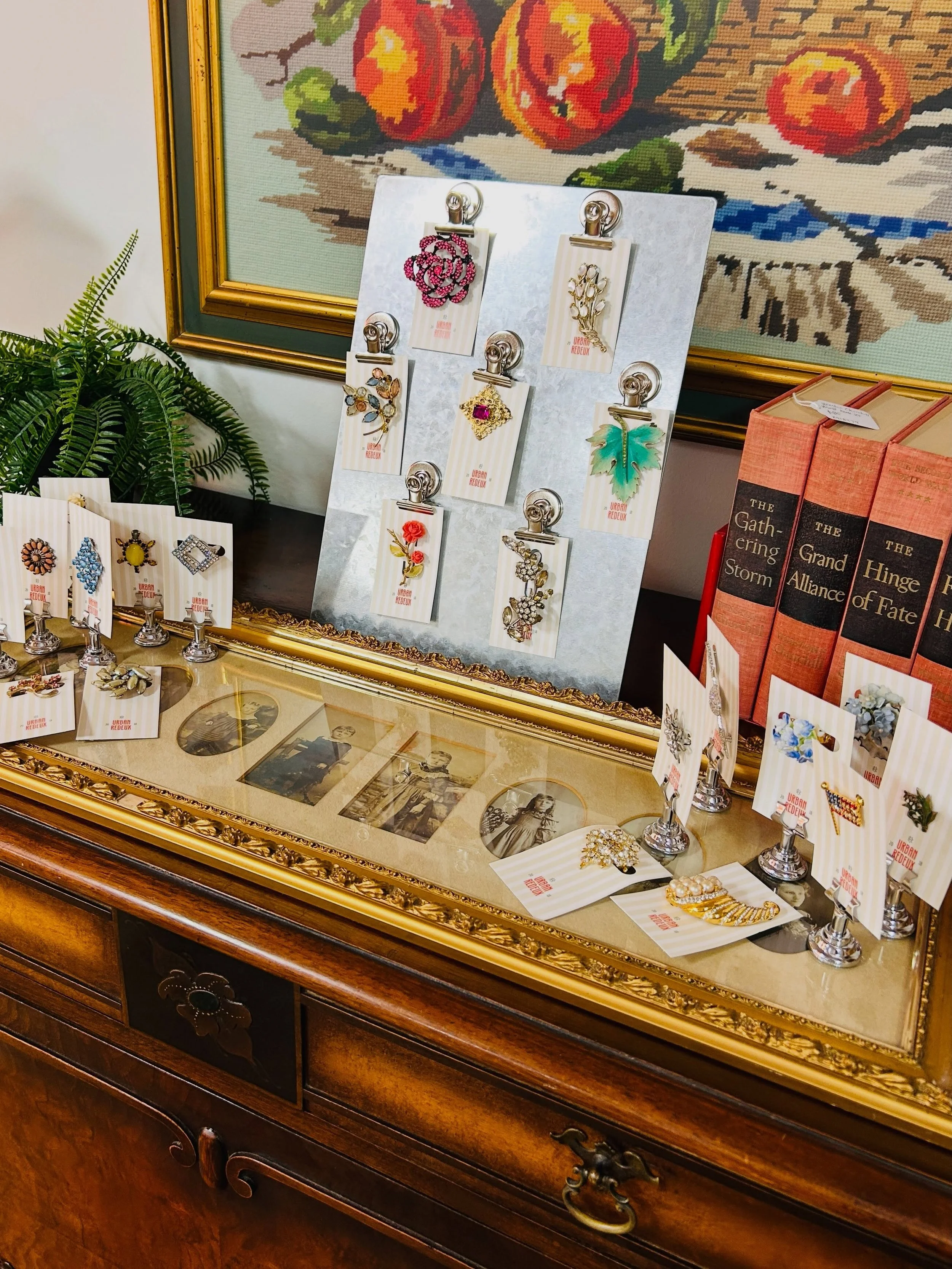 I&rsquo;m a bit obsessed with this display we created for the new collection vintage brooches we got in. Sometimes staying true to our repurposing roots is difficult when it comes to retail displays. We could buy racks and carousels and stands, but t