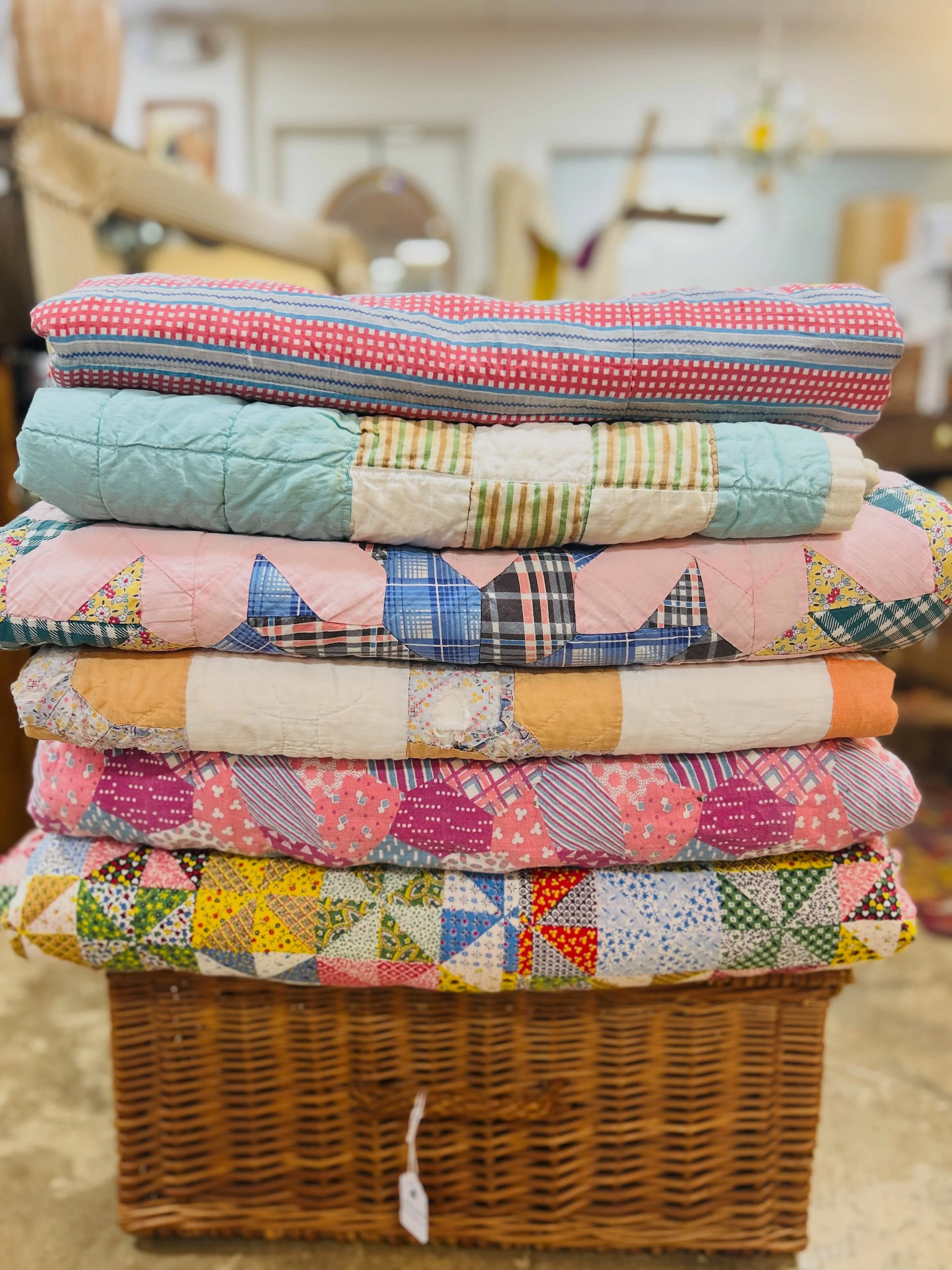 Antique and vintage quilts have arrived. These are all beautiful in their own way. Showing signs of wear from years of comforting. Some have a few small stains, some have lumpy batting from a time when real heavy cotton was used to fill these utilita