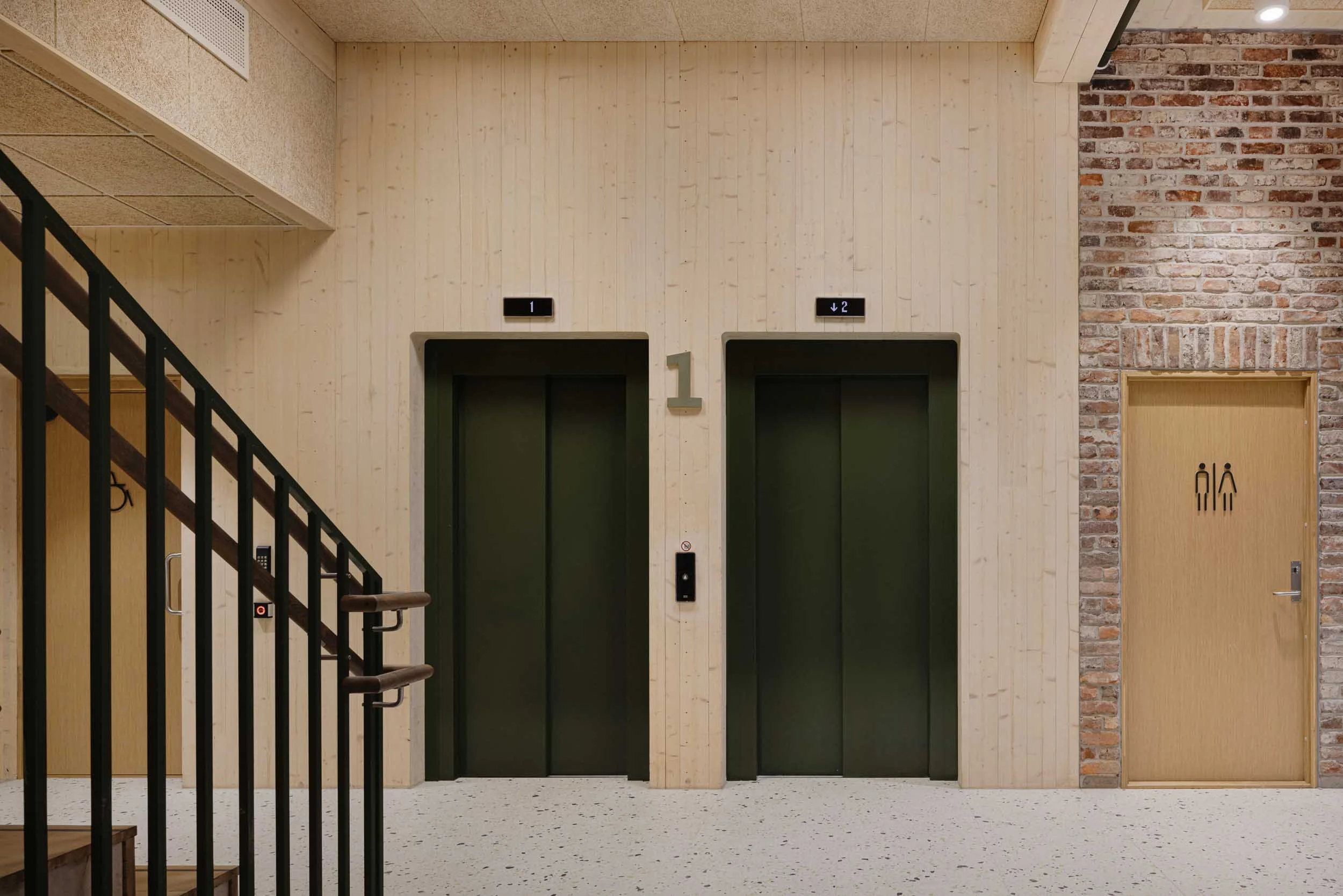 krohnen-stairwell-timber-columns-elevator-interior.jpg