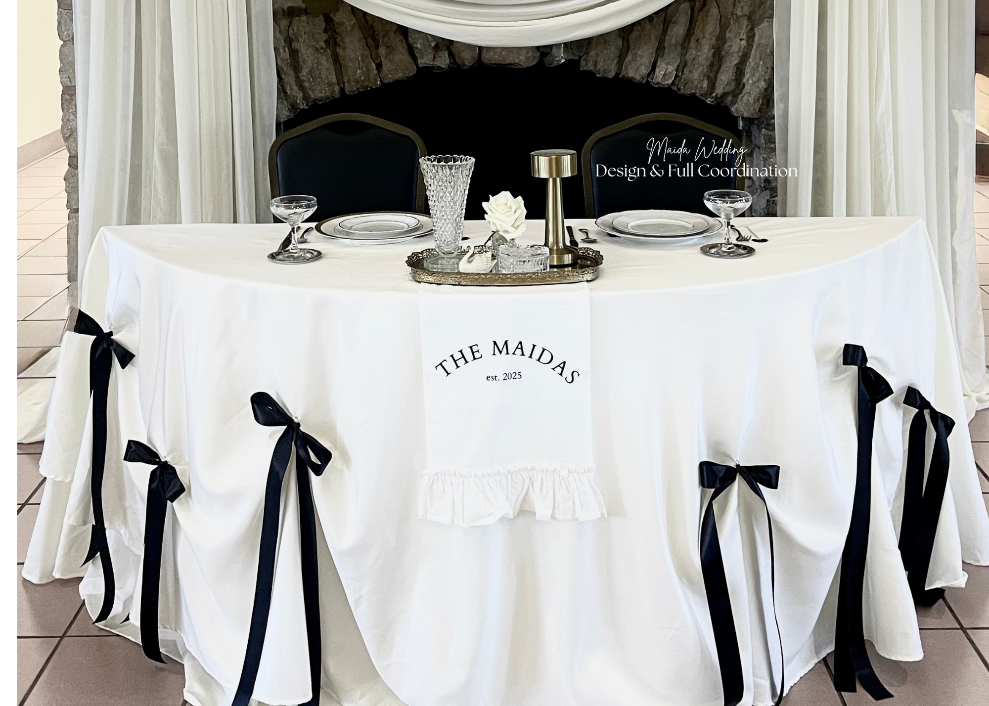 Laurie’s customers, Mariana and Carmen holding hands on a green lawn on their wedding day.