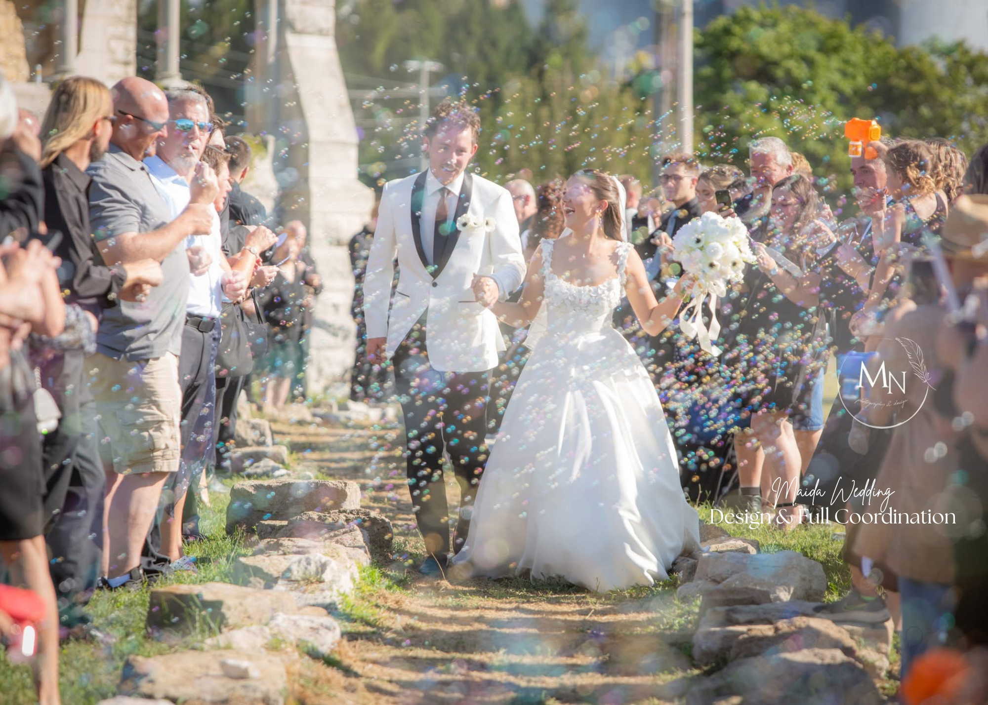 Laurie’s customers, Larissa and Emmett, just married walking off the aisle together.