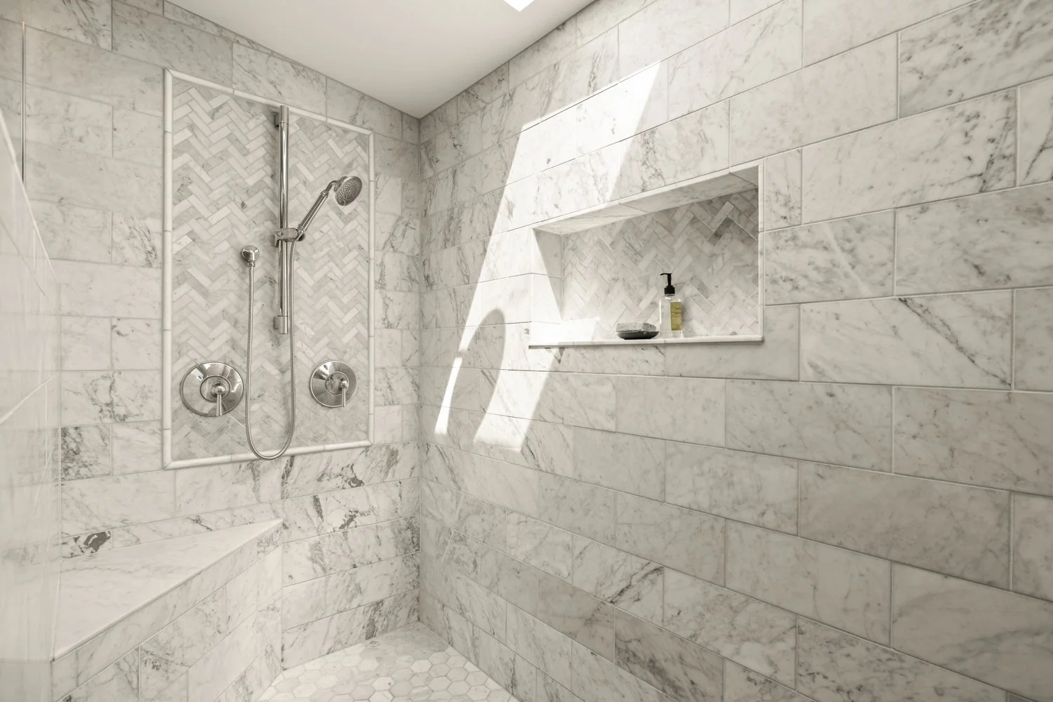 A marble shower with dual shower heads, a built-in niche with toiletries, and a bench in the corner.