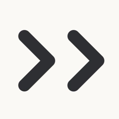 Two black arrow icons pointing to the right on a white background.
