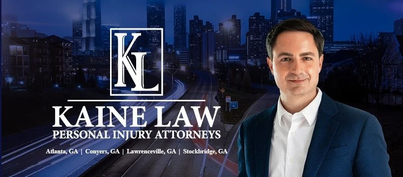 Logo for Kaine Law Personal Injury Attorneys with a cityscape background and a professional man in a suit