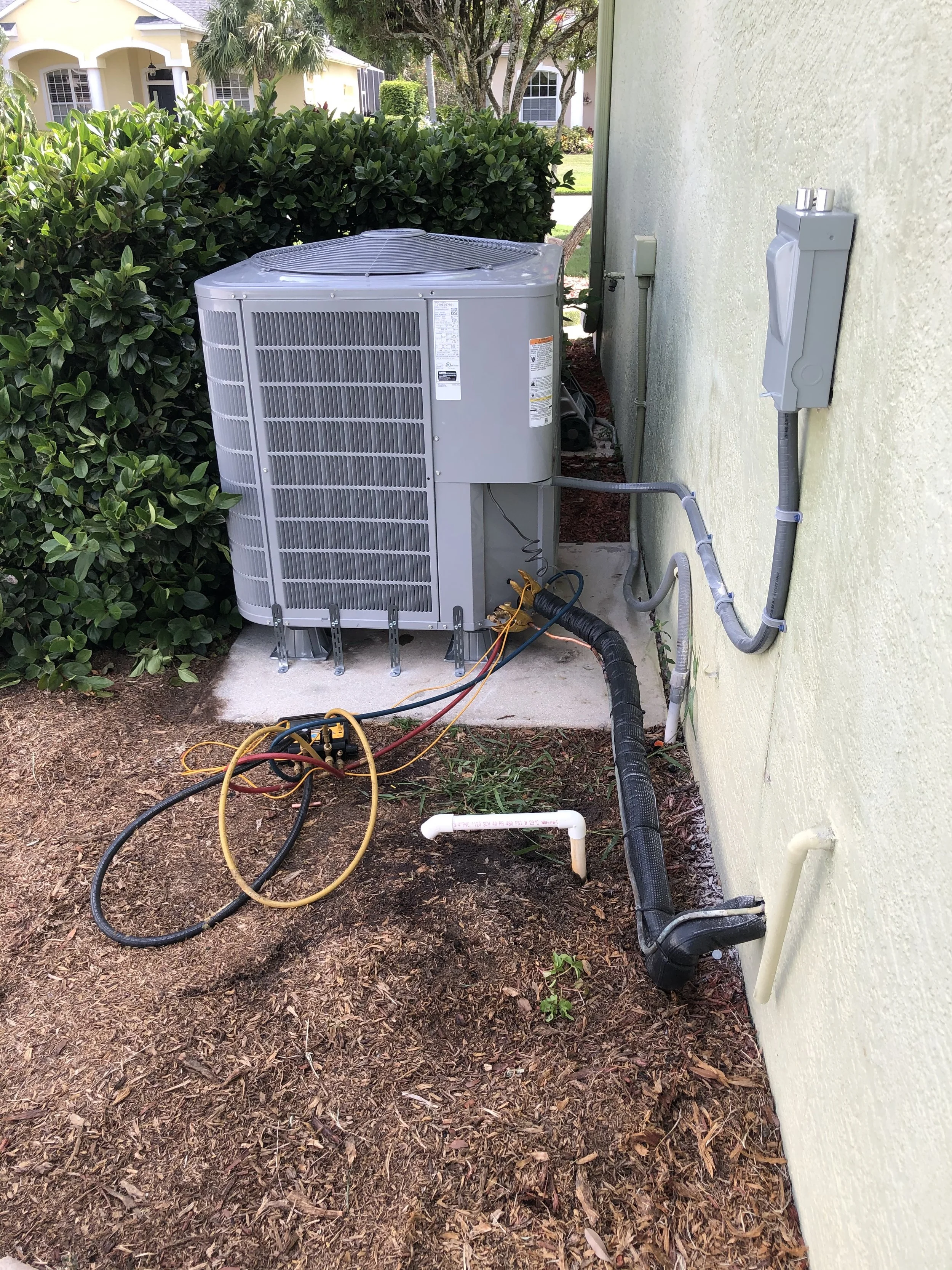 New outdoor condenser units installed for a residential property in Miami, FL. Improved cooling efficiency and system performance for year-round comfort.