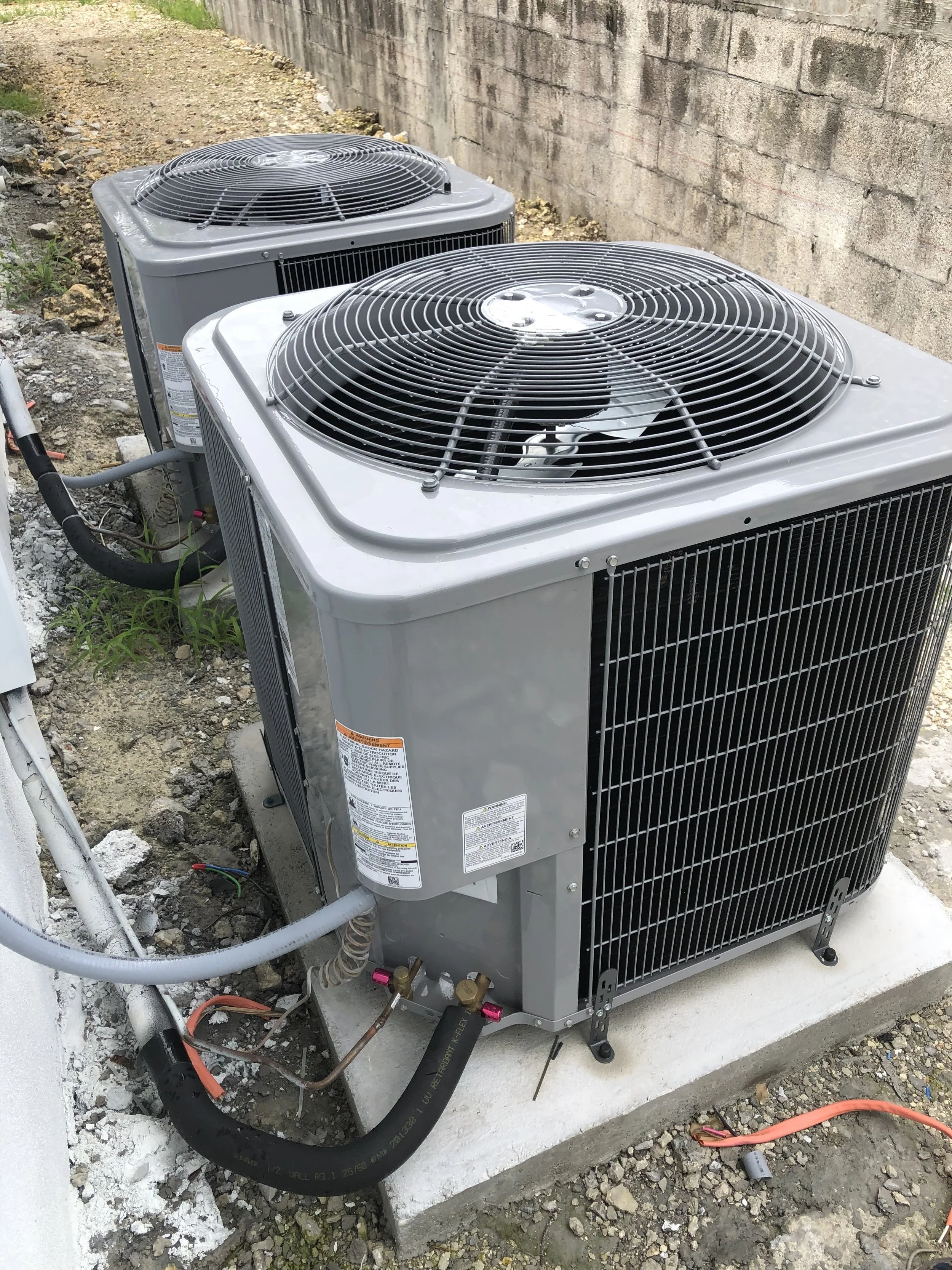 New outdoor condenser units installed for a residential property in Miami, FL. Improved cooling efficiency and system performance for year-round comfort.