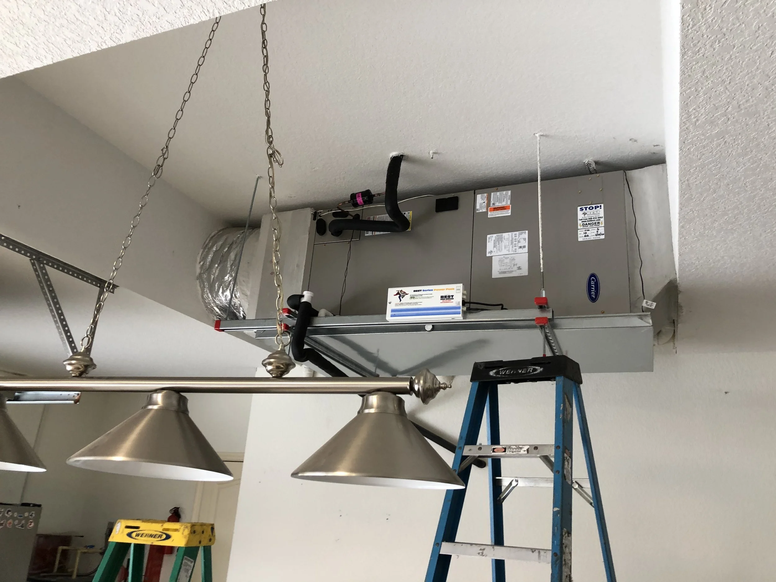 Commercial air handler installation for a warehouse facility in Miami, FL. Mounted unit provides efficient airflow distribution and improved climate control across large spaces.