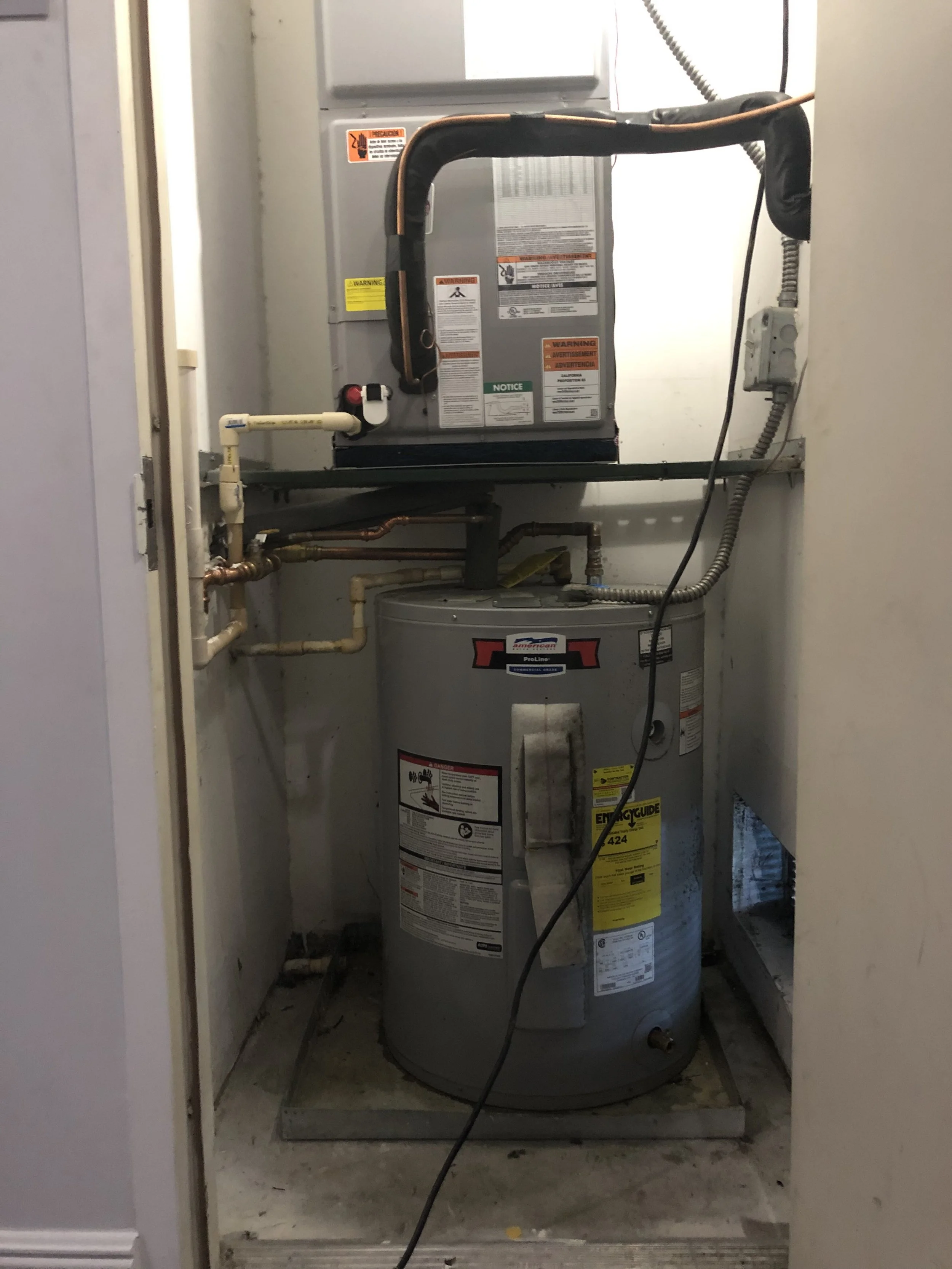 Indoor air handler and water heater setup for an HVAC system in Miami, FL. Installation ensures efficient airflow distribution and consistent indoor temperature control.