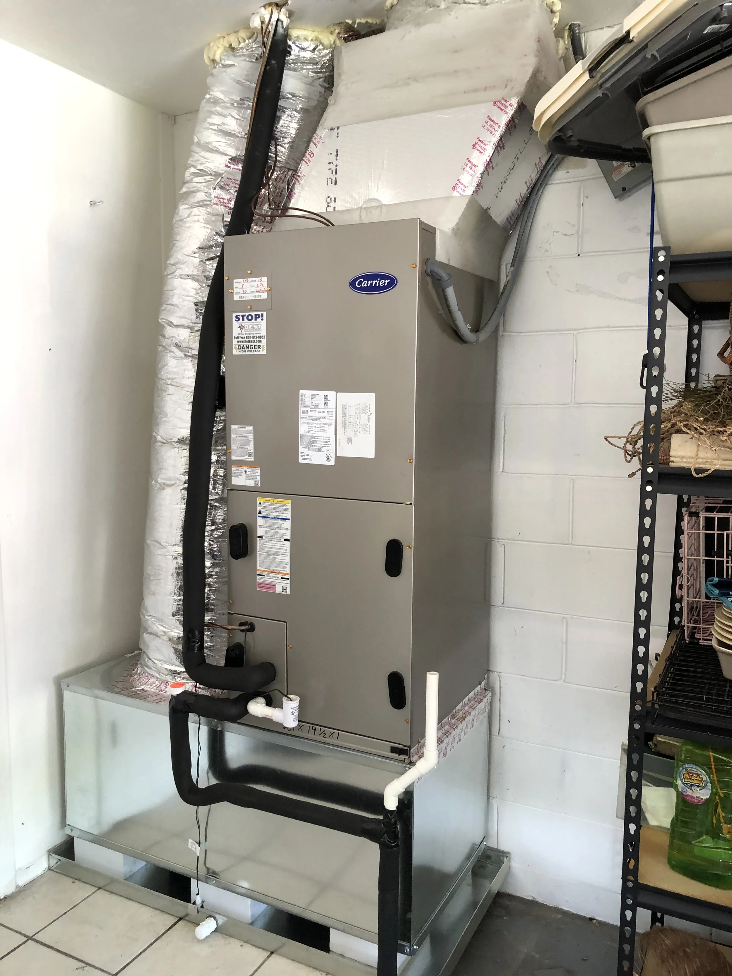 Carrier air handler installation with insulated ductwork for a residential property in Miami, FL. Designed for improved energy efficiency, noise reduction, and consistent indoor comfort.