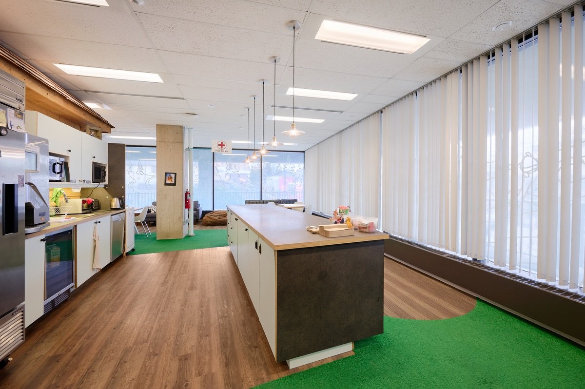 The North House communal kitchen with a long island and natural light