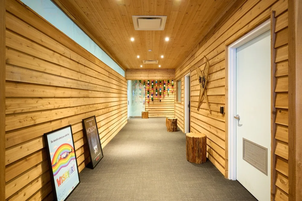 The warm cedar-lined corridor inside North House Vancouver