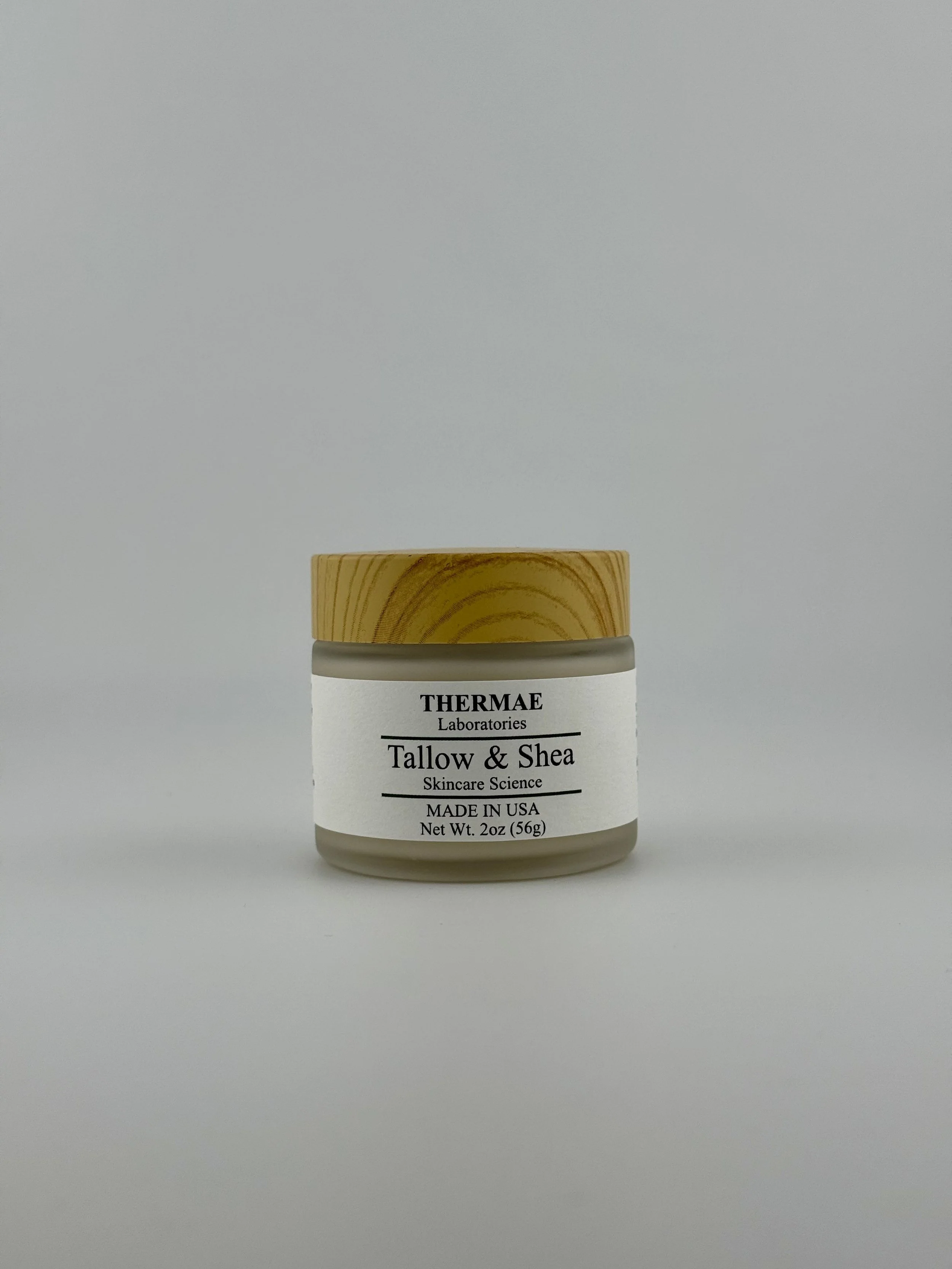 A jar of Skincare cream labeled Tallow & Shea from THERMAE Laboratories on a white background.