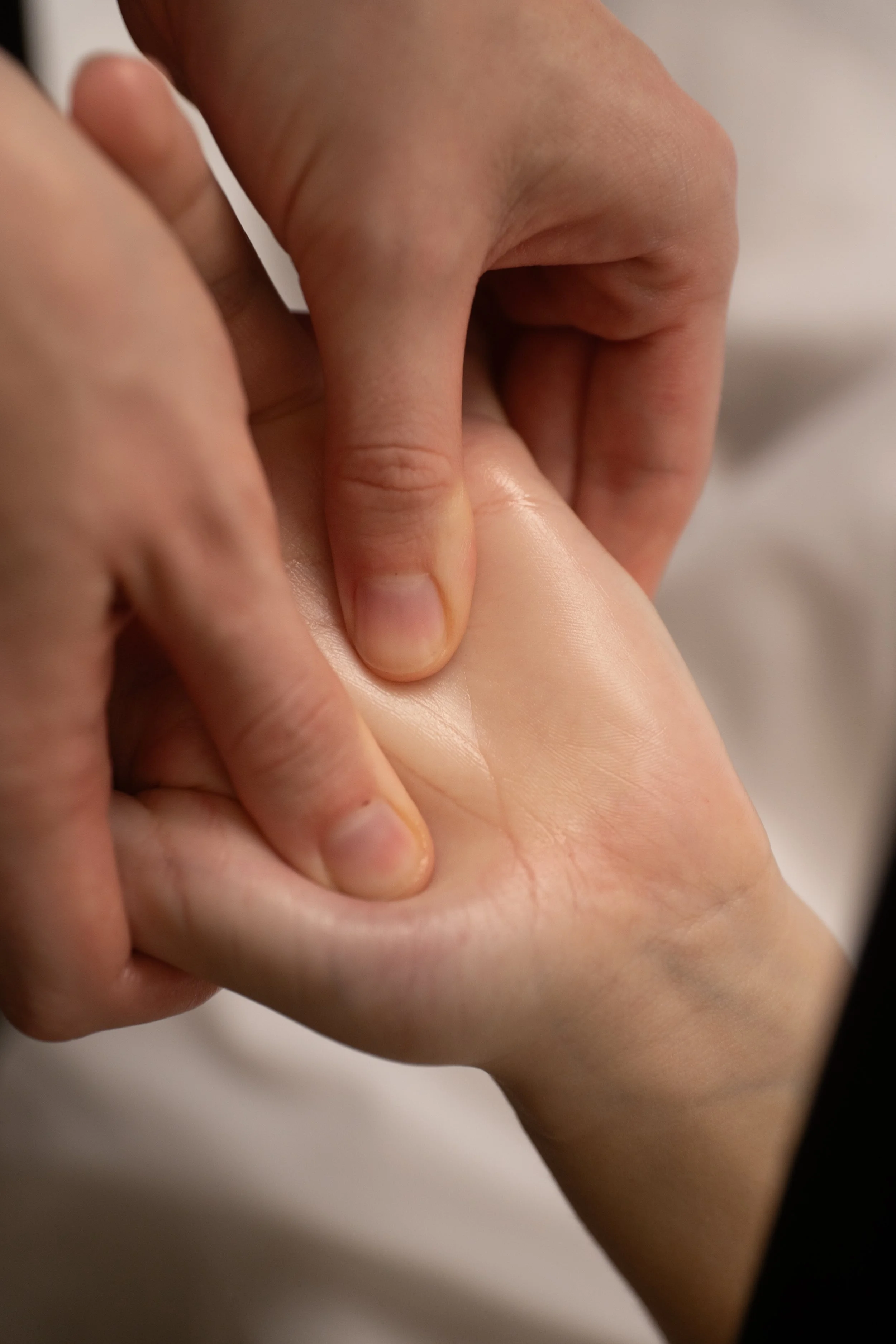 Hands massaging a hand from an RMT in owen sound