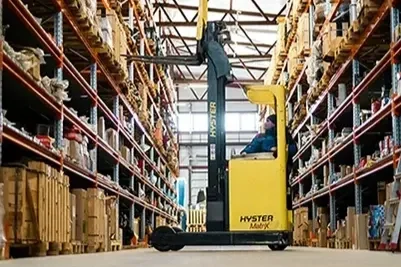 Yellow forklift in warehouse representing operational efficiency and business improvement services.