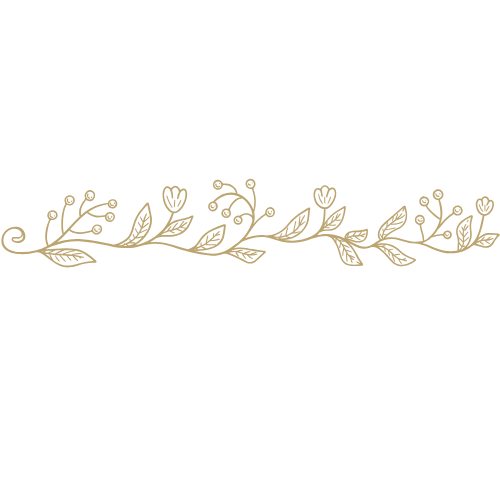 A decorative horizontal floral design in gold on a black background.