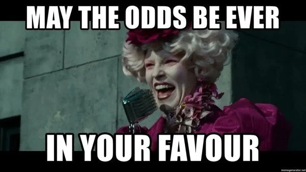 Meme of Effie from The Hunger Games wiuth the text "May the Odds be Ever in your Favour"