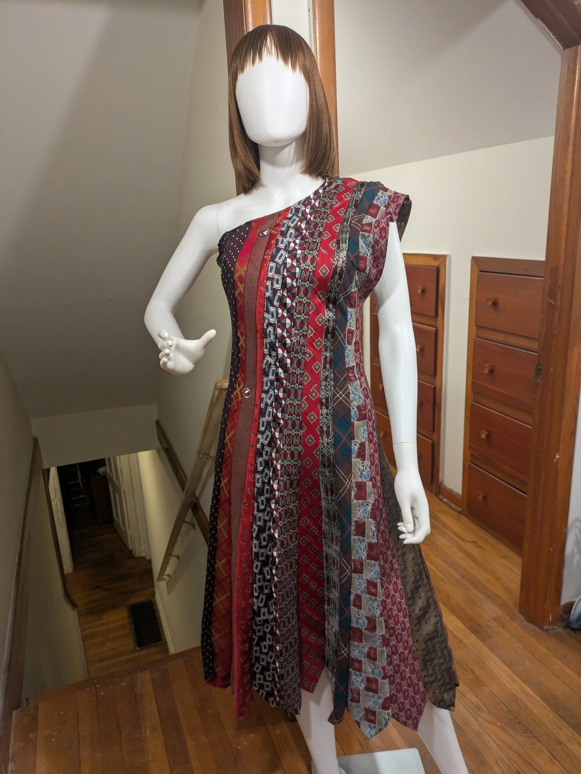 This dress is an one shoulder dress made completely out of neck ties.