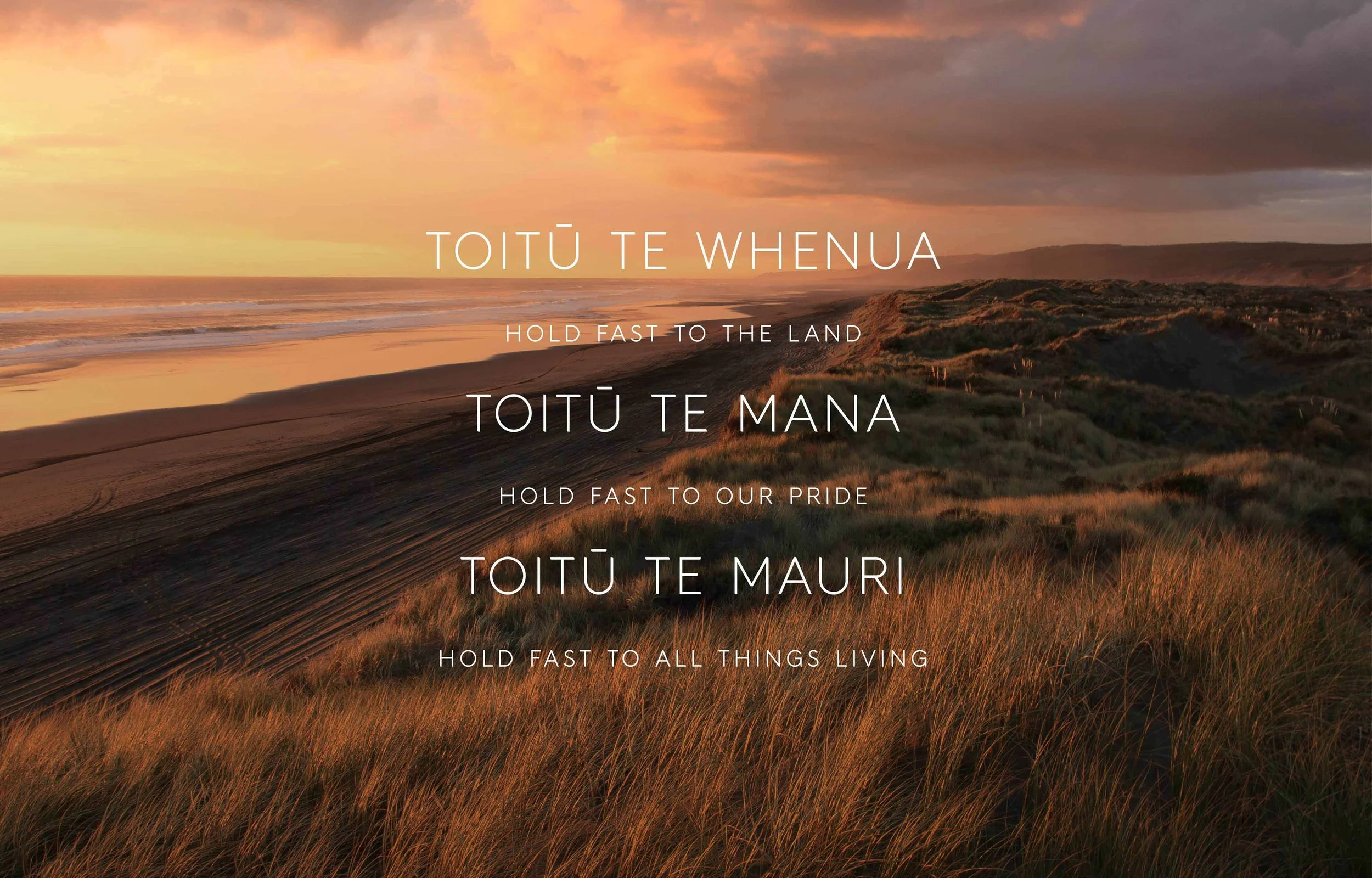 A scenic coastal landscape at sunset with sandy dunes, grass, and the ocean in the background, overlaid with text in Māori and English.