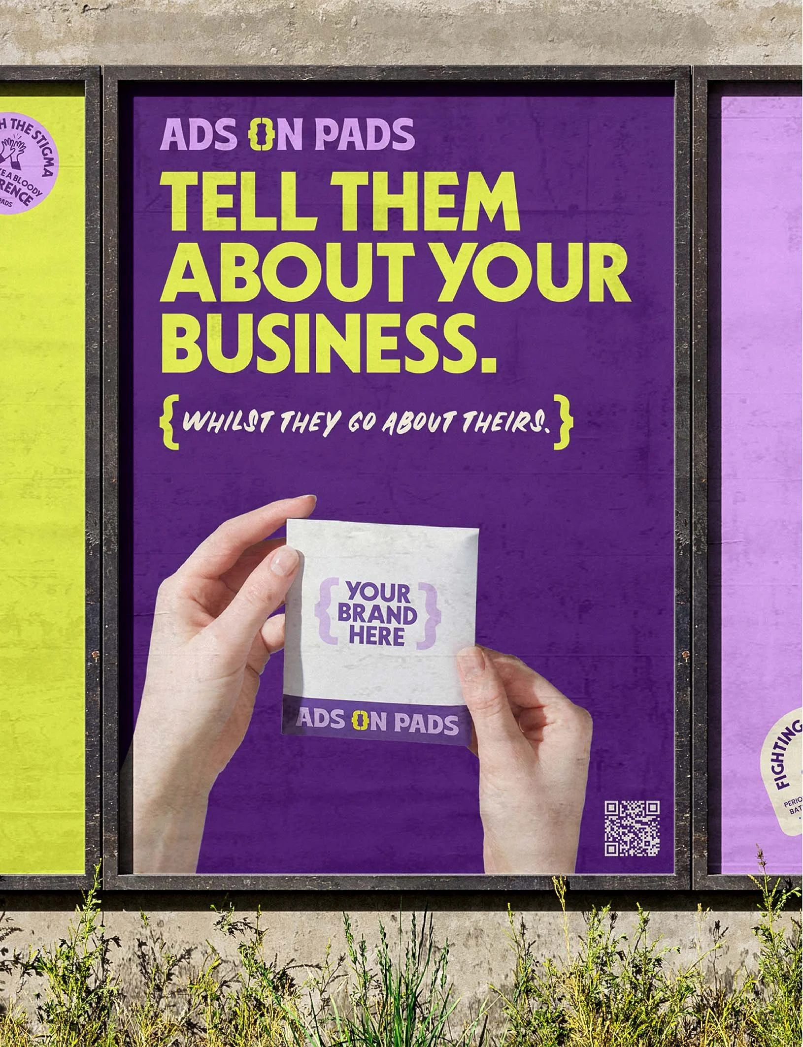 A large advertisement poster on a purple background with the text 'Ads on Pads, Tell them about your business, whilst they go about theirs'. The image depicts a hand holding a paper with the text 'Your Brand Here' and the logo 'Ads on Pads'. There is a QR code at the bottom right corner of the poster.