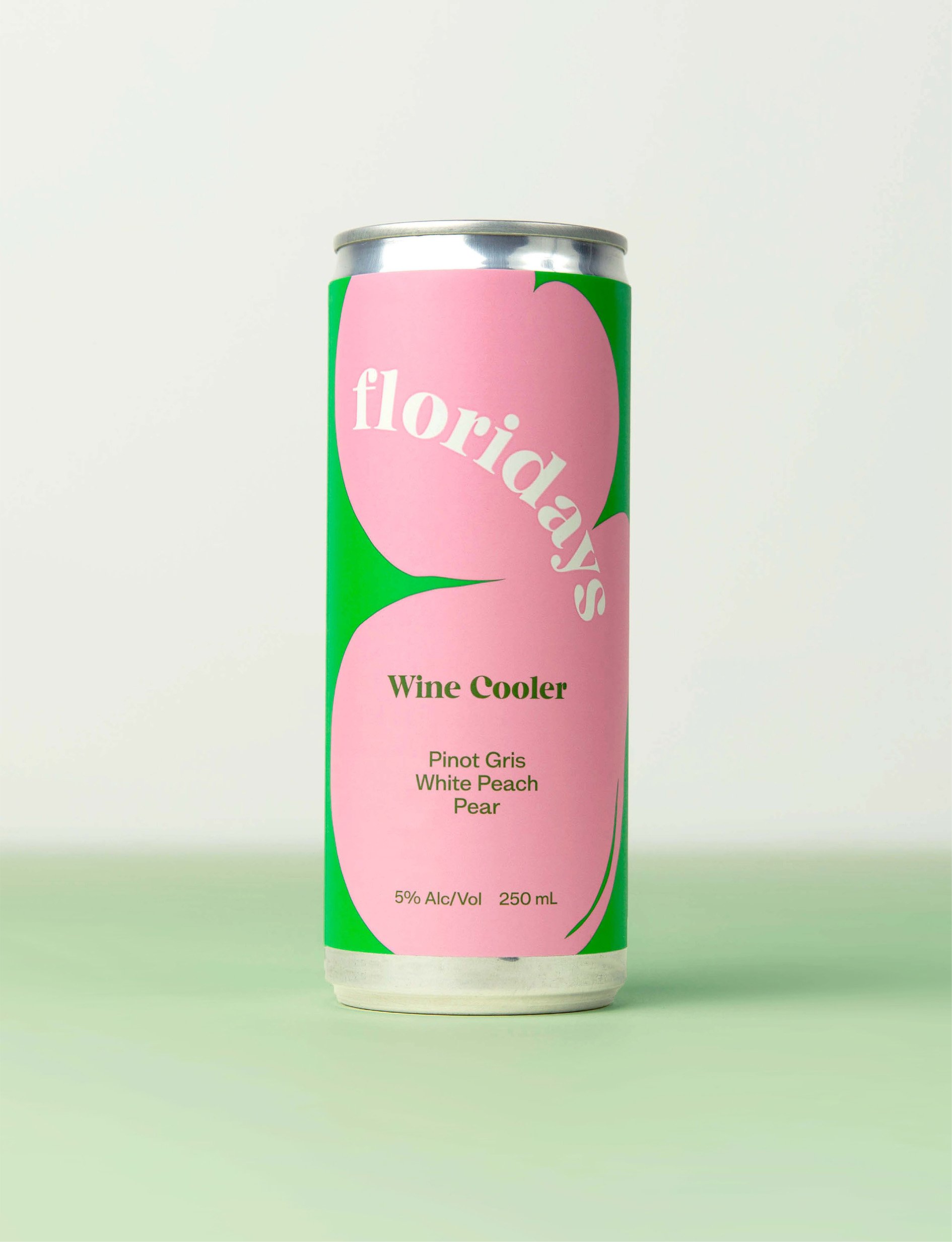 A cylindrical can with a pink label featuring large green and pink abstract shapes. The label reads "Florida's" at the top, and "Wine Cooler" in the middle. Below that, it lists "Pinot Gris, White Peach, Pear," and states "5% Alc/Vol 250 mL" near the bottom.