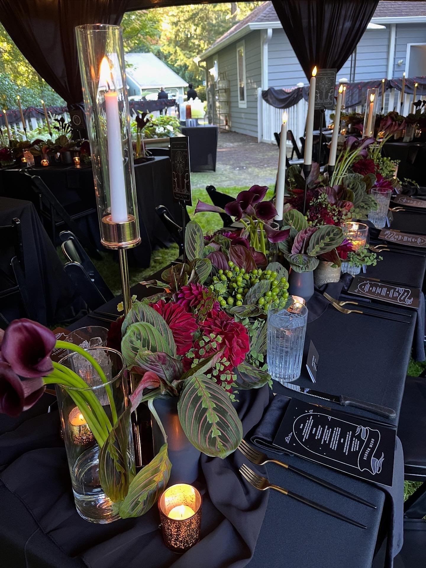 Halloween/goth weddings are our favorite! This one&rsquo;s decor and vibe was absolutely haunting&mdash;from the exquisite tropical and burgundy florals, to the tarot card table numbers, from instrumental horror movie music, and the custom &ldquo;&ls