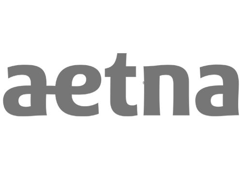 A logo with the text 'aetna' in lowercase letters