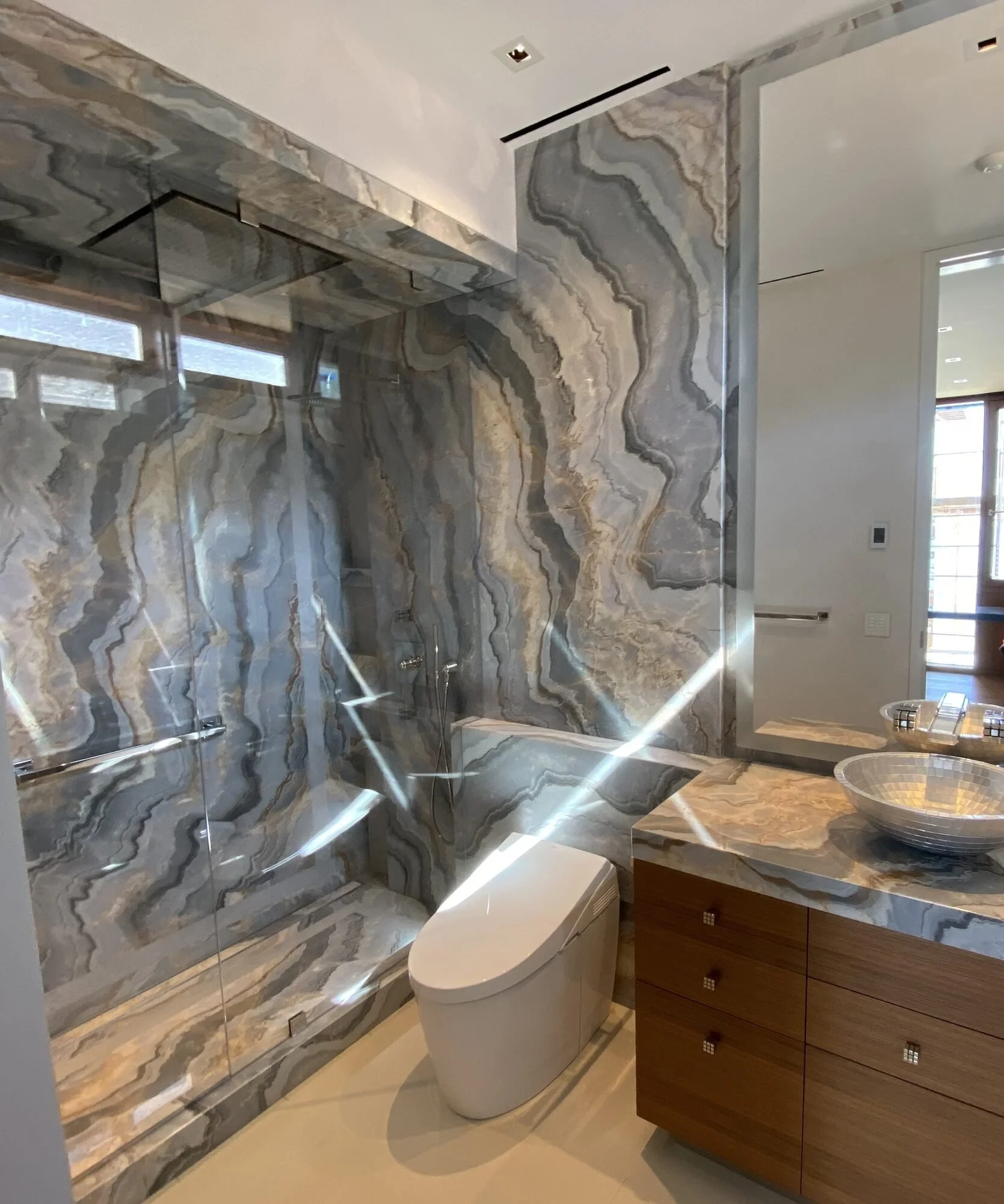 bookmatched-stone-bathroom.jpg