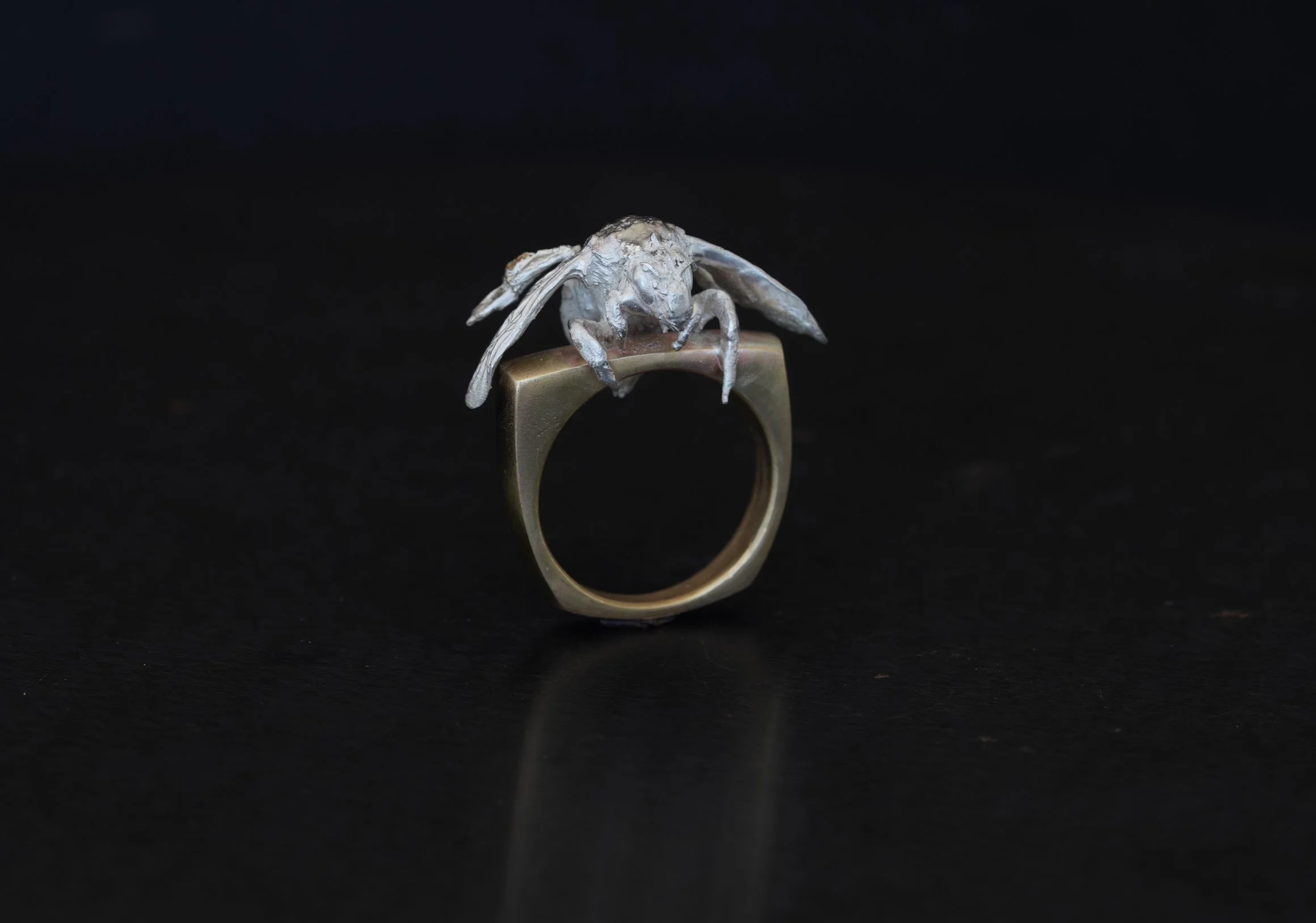 Bee Holding Brass Ring
