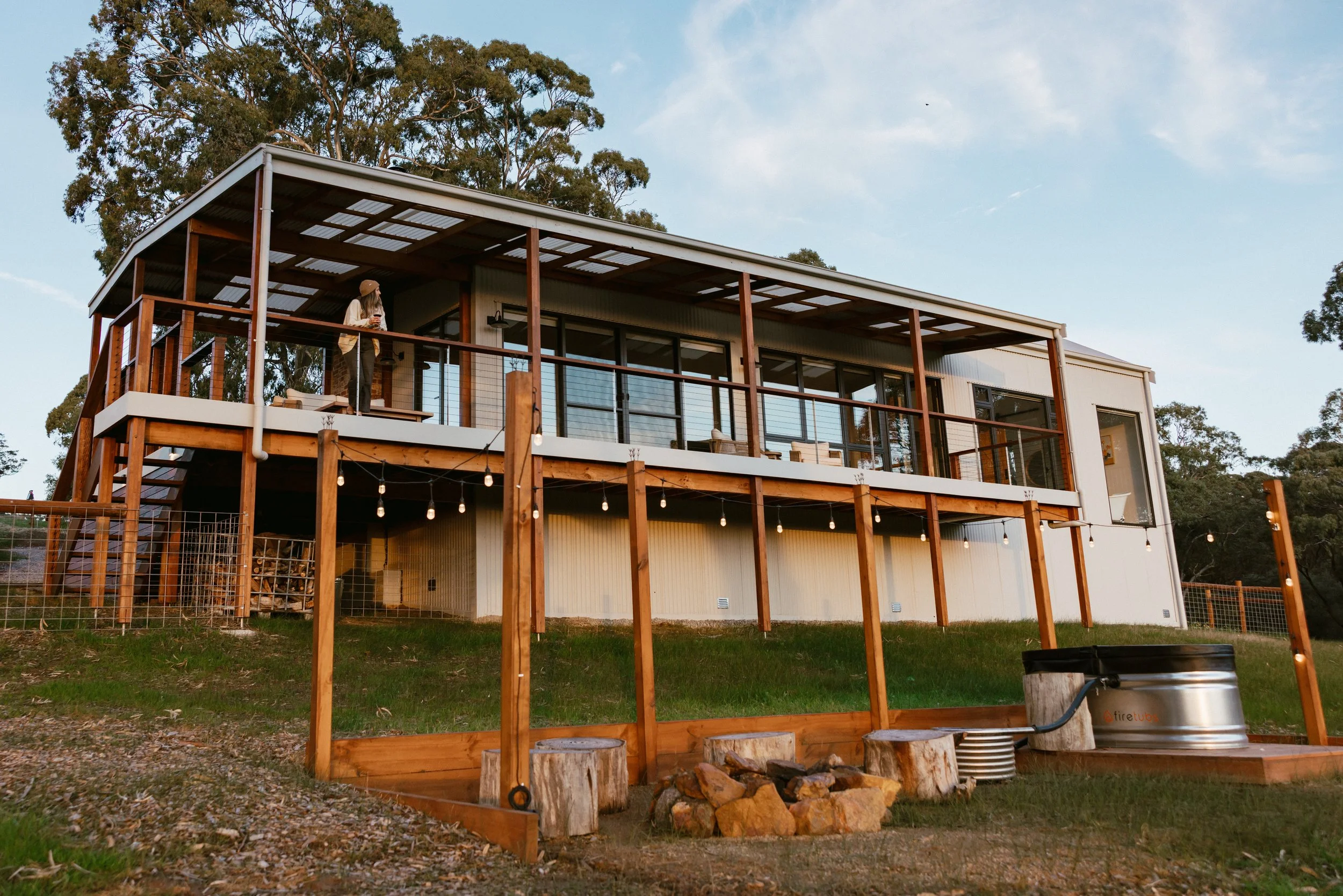 Escape One is slightly more elevated, overlooking the fire tub and camp fire, with spectacular views and over vineyards to the coast