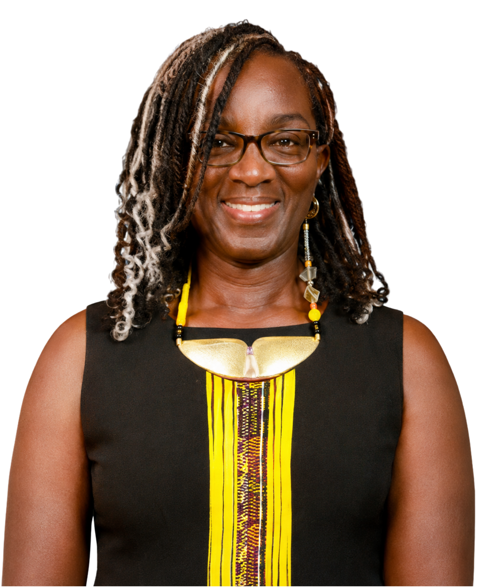 A smiling Black woman wearing glasses, earrings, and a traditional African dress with yellow, black, and red patterns.