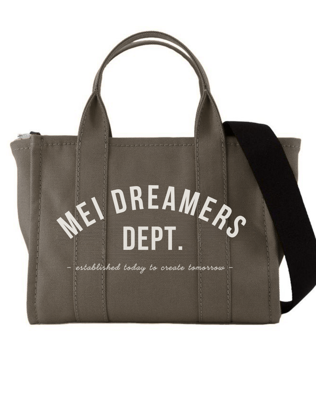 A gray tote bag with black strap, with text 'Mei Dreamers Dept.' and a quote 'established today to create tomorrow' written on it.