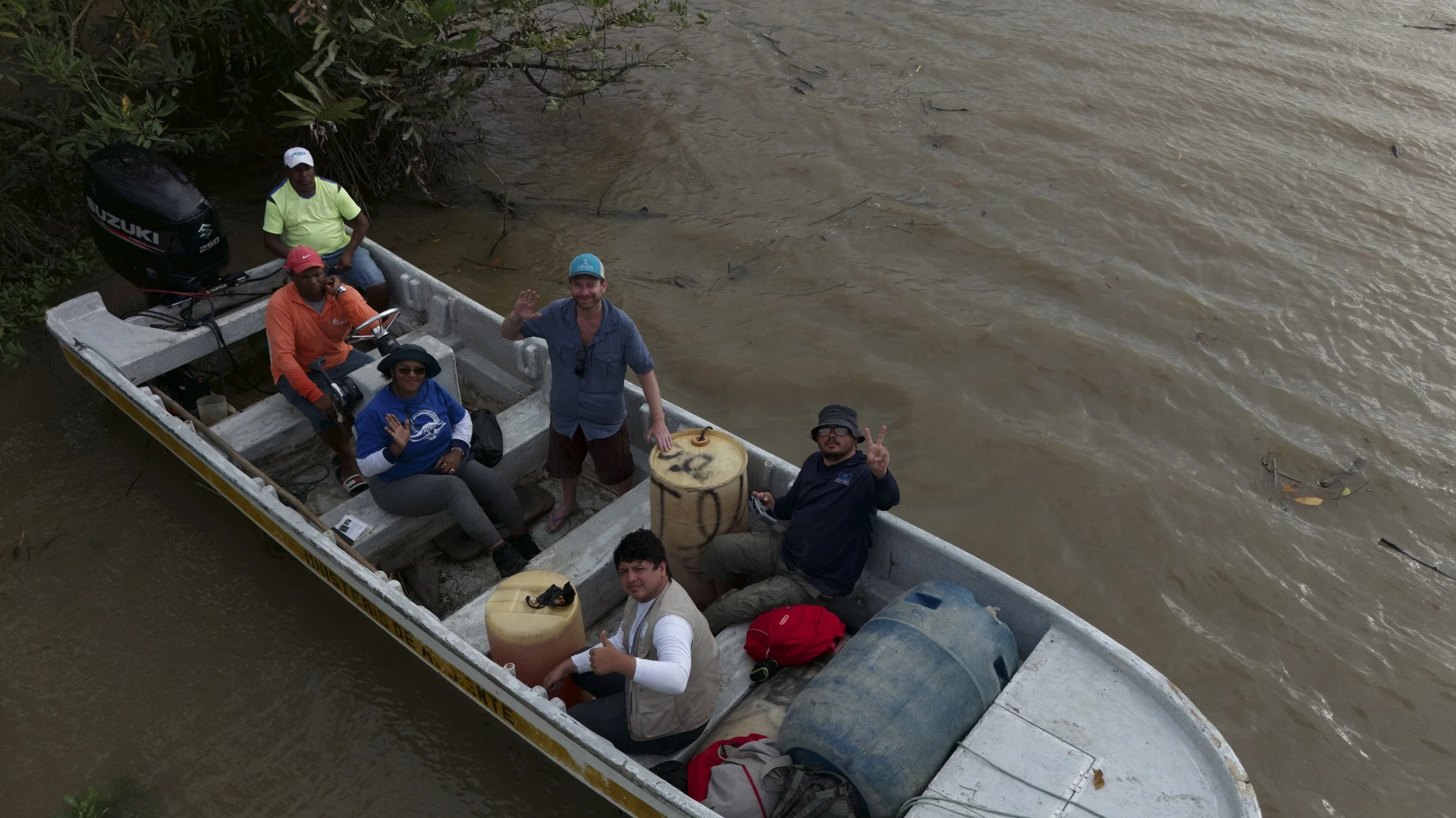 Field representatives travelling by boat during mangrove research in Panama