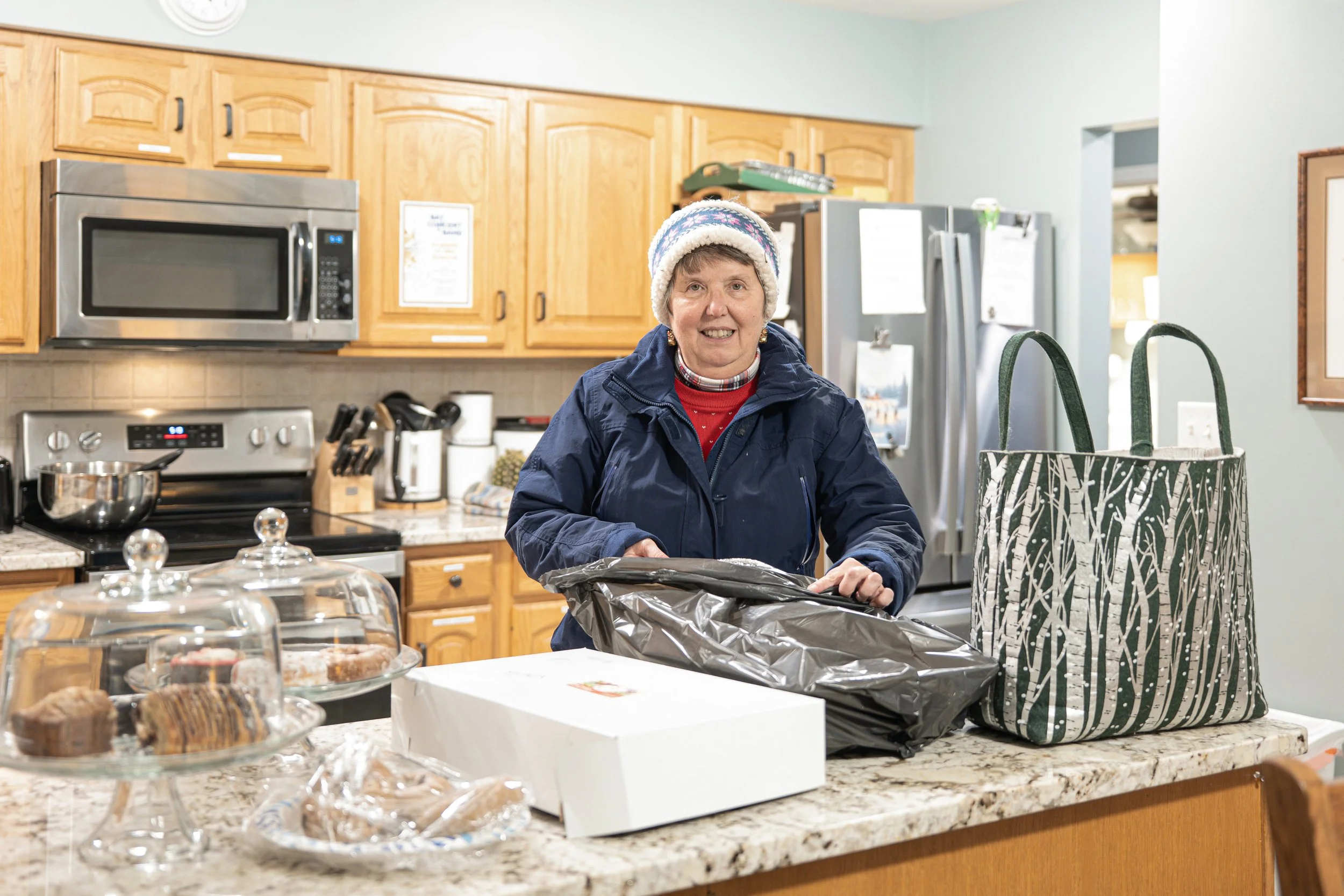Volunteer prepares food supplies at the Toni & Trish House