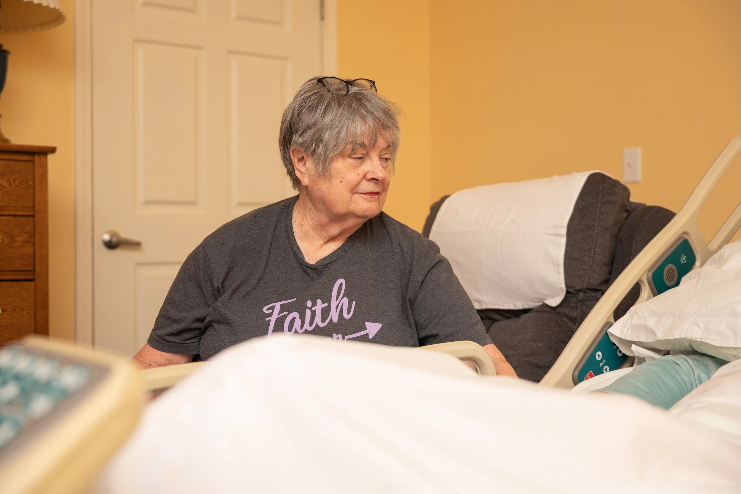 Volunteer comforts a guest at the Toni & Trish House
