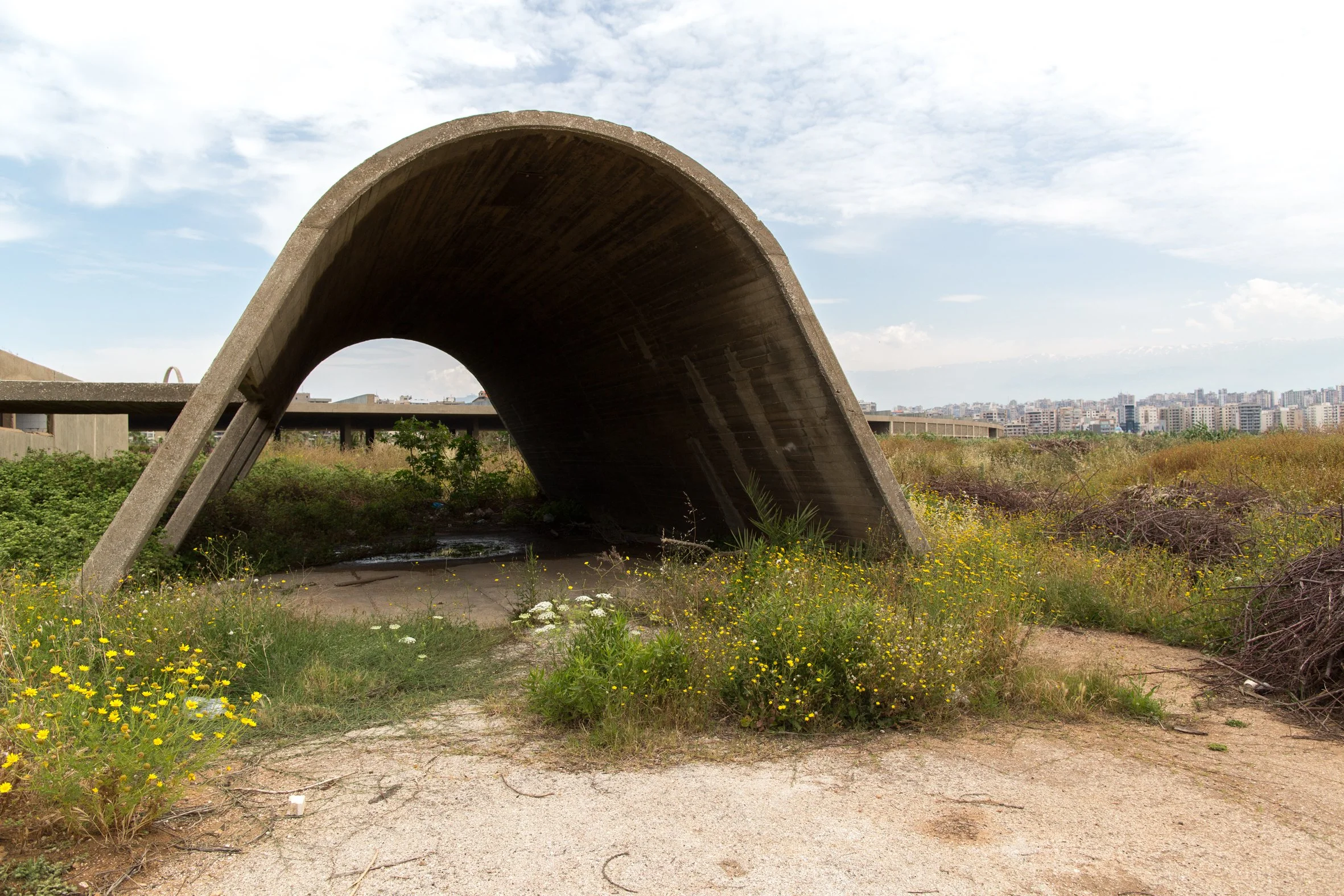 A concrete arch forming part of the administrative quarter. This area was allegedly a site of detention and torture during the Lebanese civil war. 