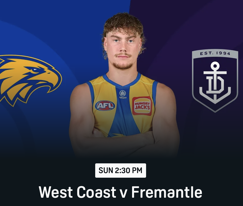 Australian Football League player in yellow and blue jersey with sponsor logos, standing with arms crossed in front of a background displaying West Coast Eagles and Fremantle Dockers logos, and a scheduled game time of Sunday 2:30 PM for a match between West Coast and Fremantle.