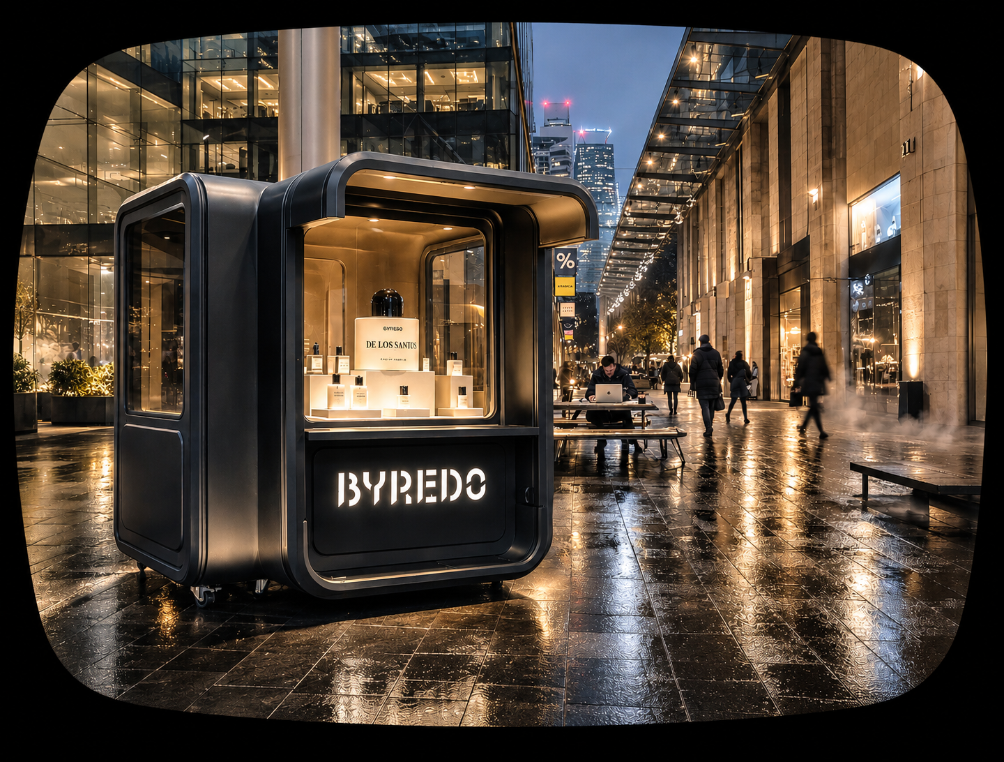 City street scene at night with a black BYREDO perfume kiosk in the foreground, illuminated perfume bottles inside, people walking on wet pavement, modern glass buildings, and office skyscrapers in the background.