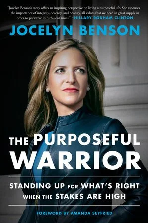 Book cover of 'The Purposeful Warrior' by Jocelyn Benson featuring a portrait of Jocelyn Benson with blonde hair, wearing a dark blazer, and looking to the right.