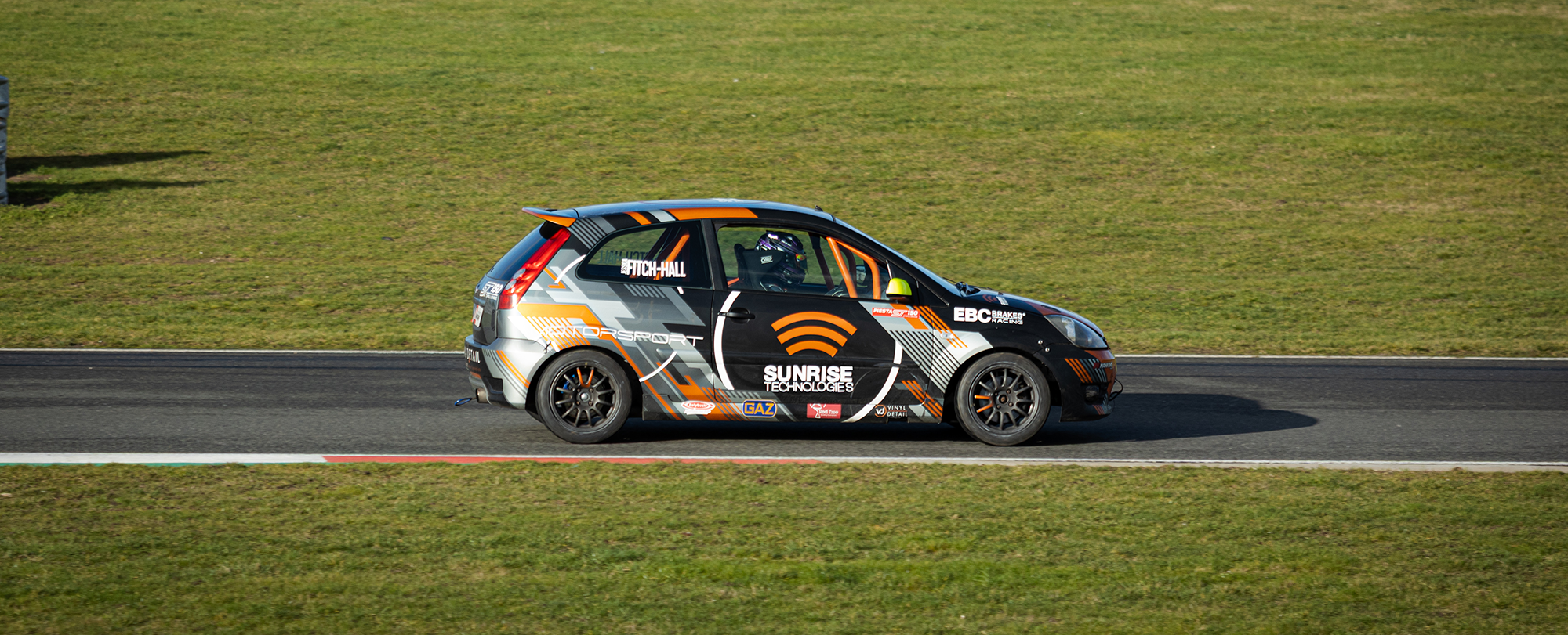 Supporting the Automotive industry with IT and at Grassroots Racing.