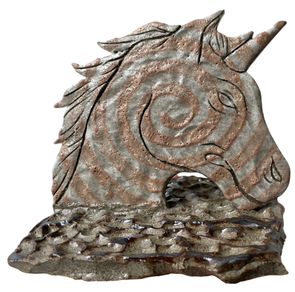 ceramic unicorn bookend with a spiral deisgn in dark clay