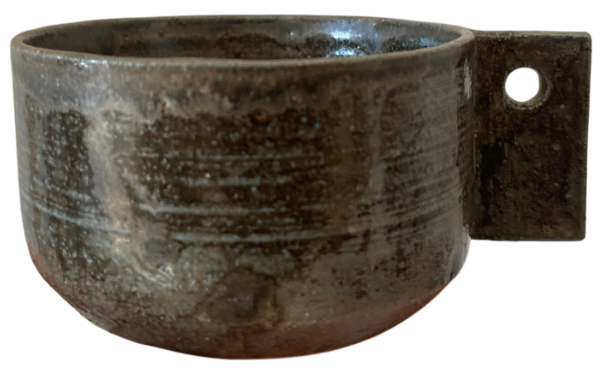 Handmade ceramic mug in dark brown tones with unususal handle