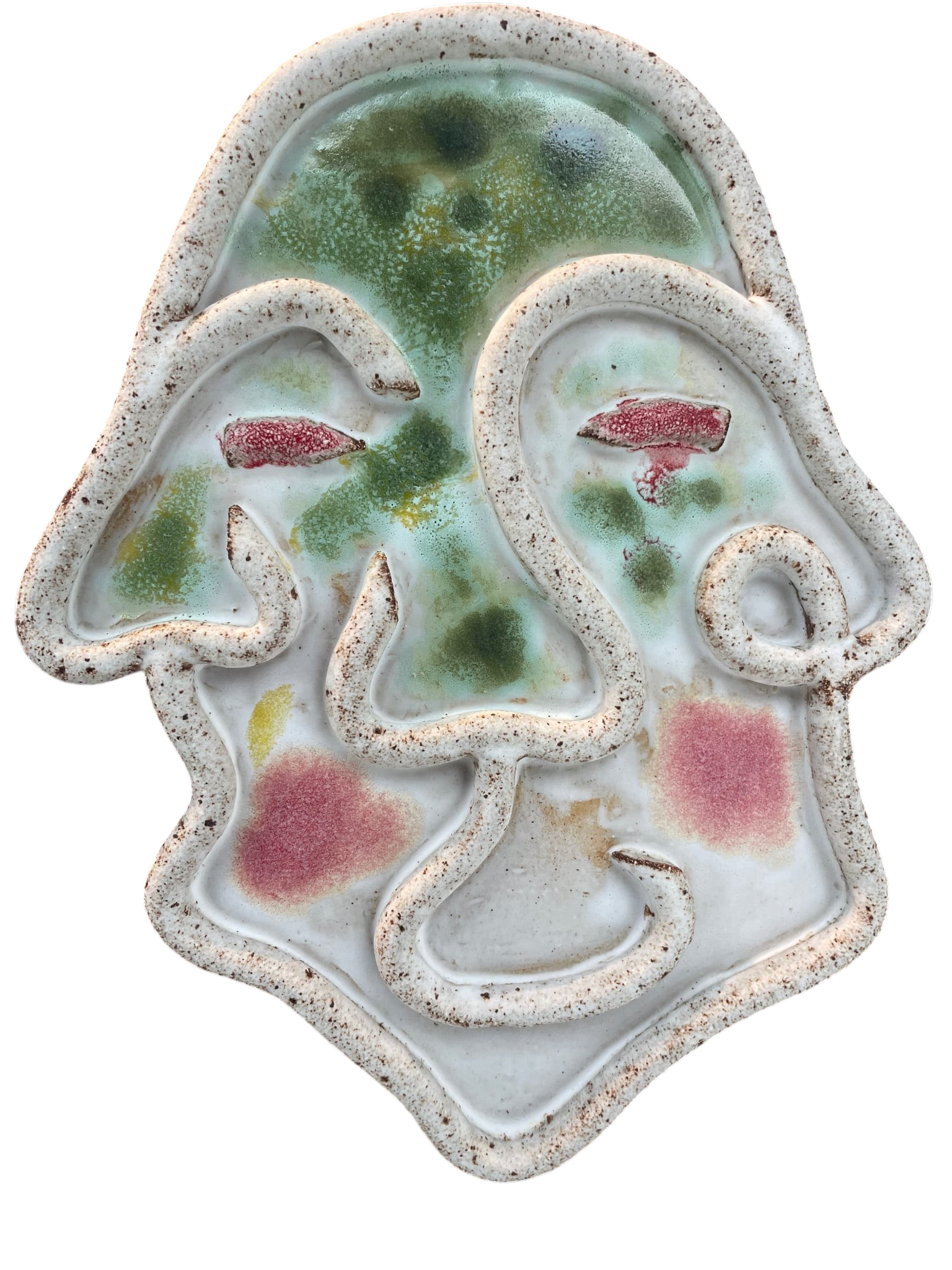 A decorative ceramic skull with embedded colorful glass pieces and textured edges.
