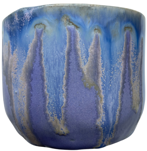 small stoneware cup without a handle and with special glazing in lilaz, blue and yellow