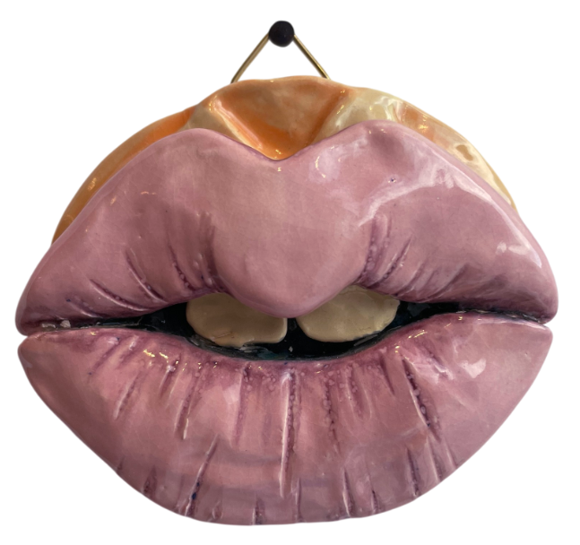 Ceramic sculpture of pink lips as wallart